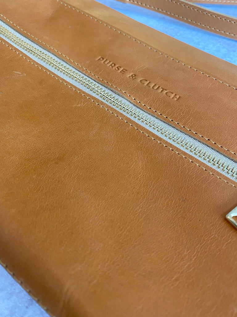Zipper detail on convertible crossbody and clutch bag