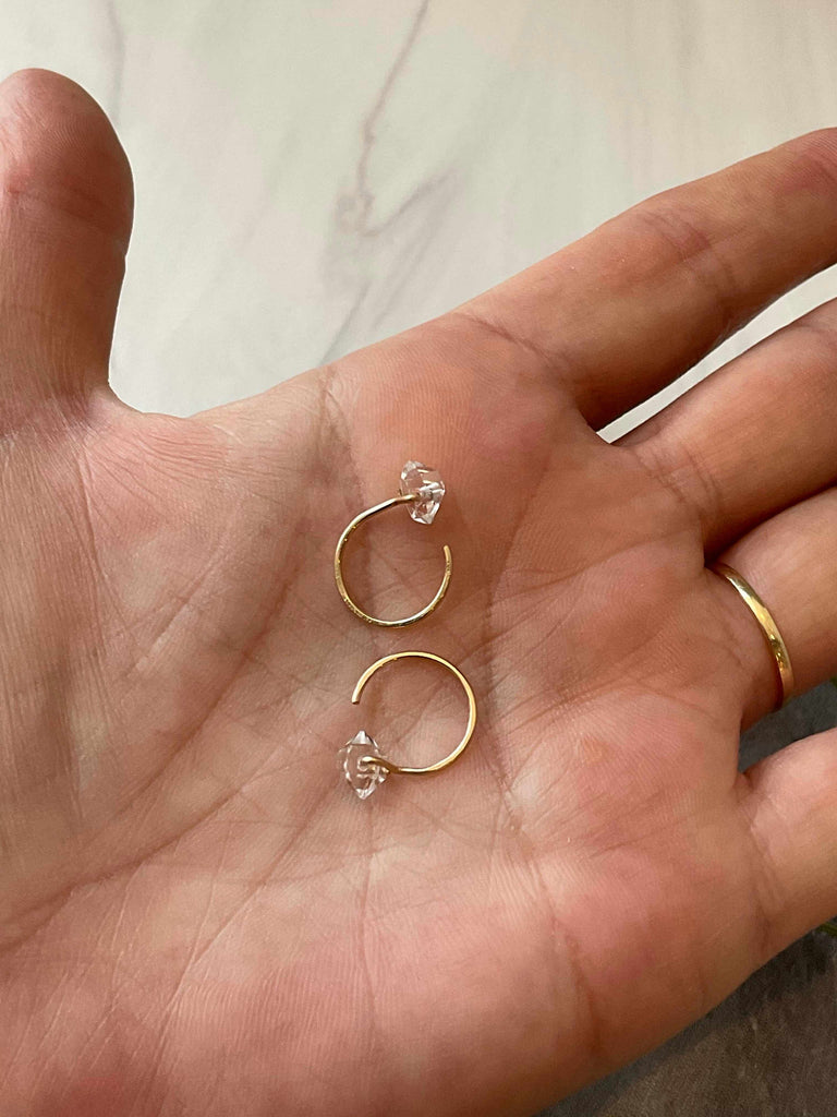 Person holding 14k Gold Fill Hug Hoop Earrings with Herkimer Diamond