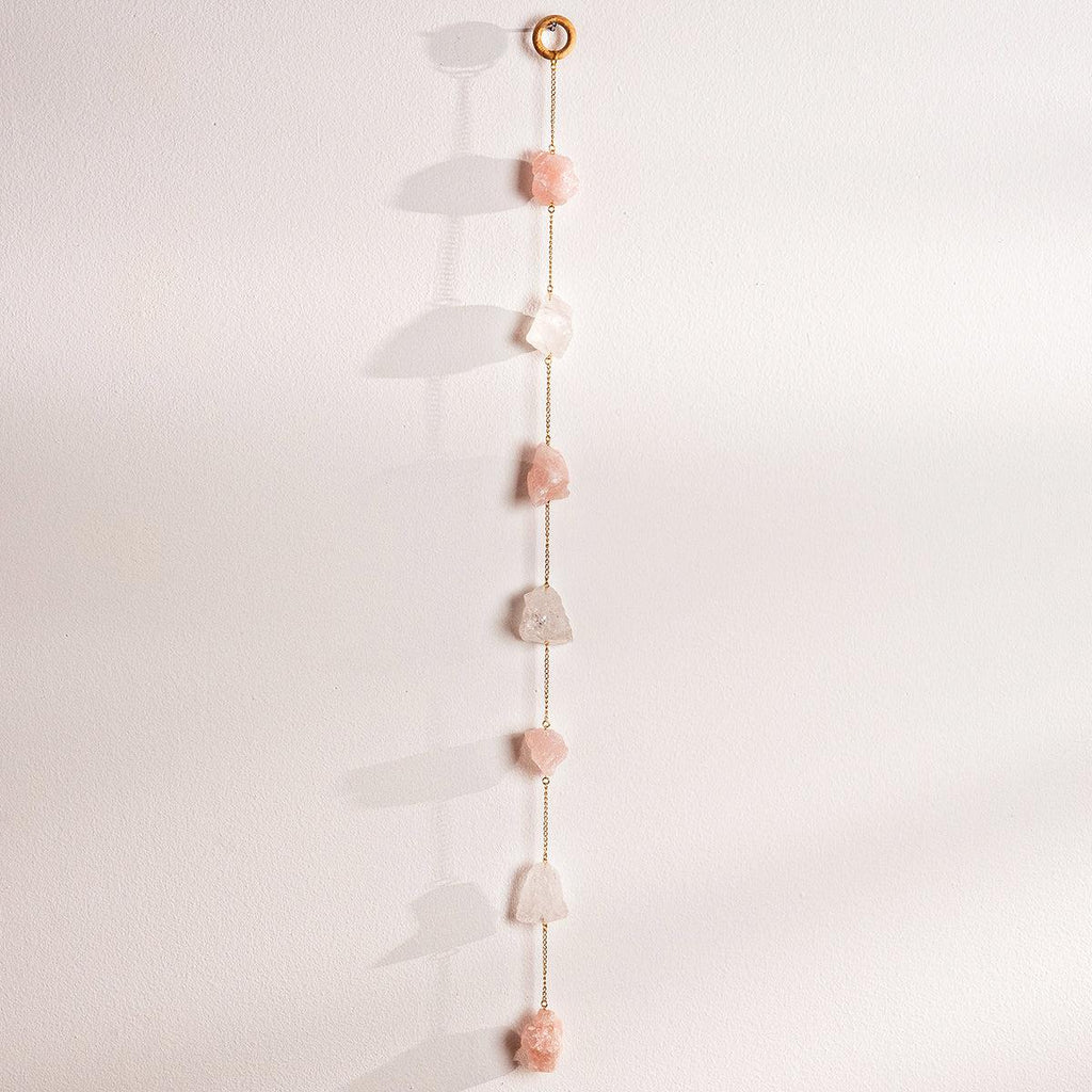 Love Wall Hanging with clear and rose quartz in sunlight