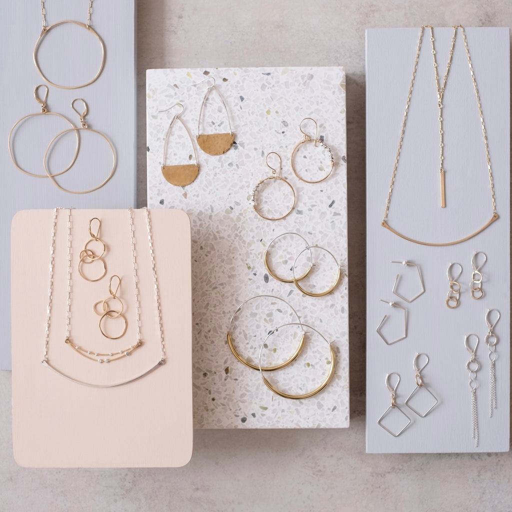selection of dainty gold and silver jewelry