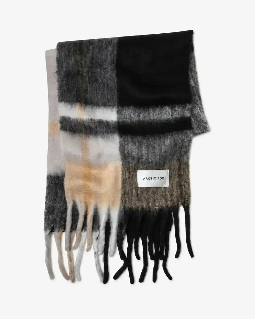 Plaid scarf with fringes on a white background