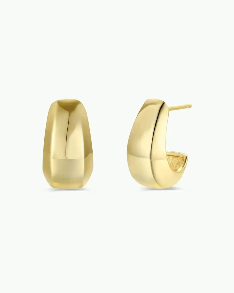 Gold hoop earrings on a white background