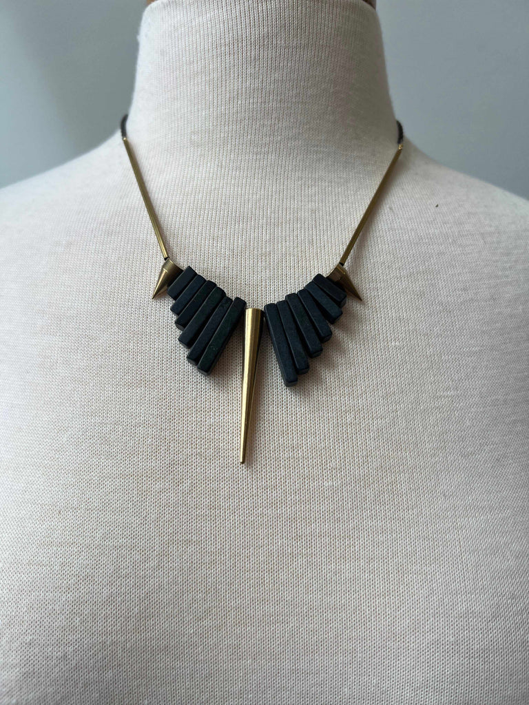 Geometric Black Agate and Brass Spike Necklace on Mannequin