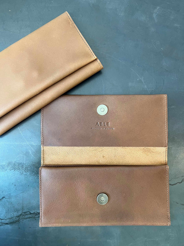 Snap closure on Able Debre leather wallet