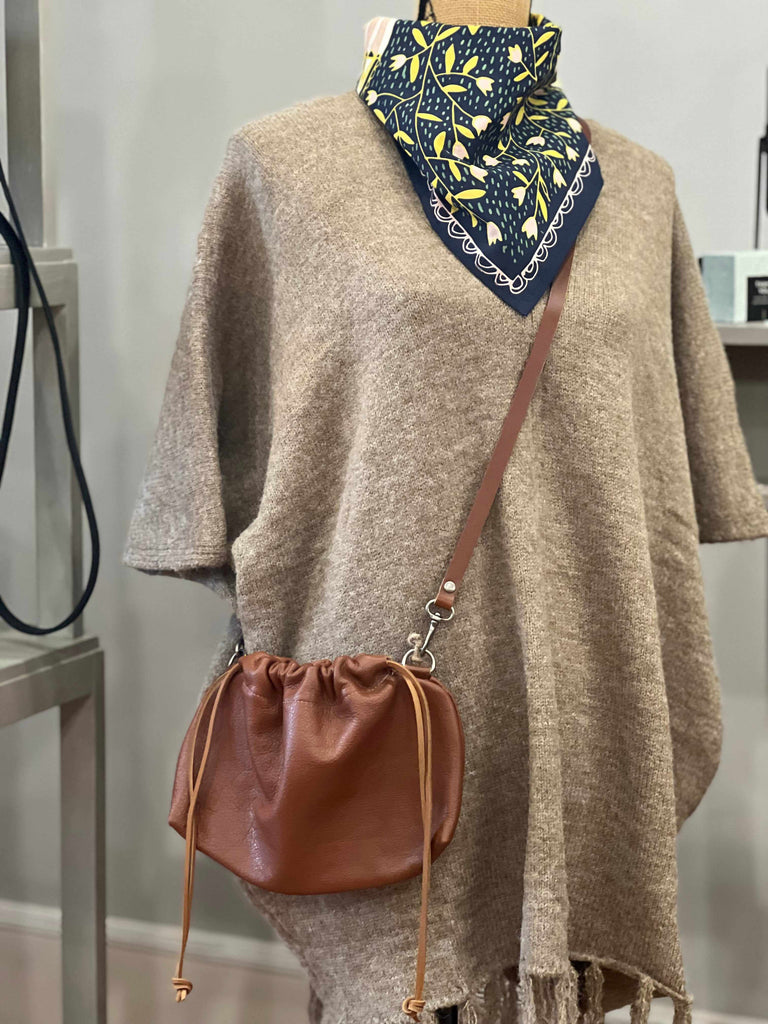 Fringe Hem Knit Poncho in twig on mannequin