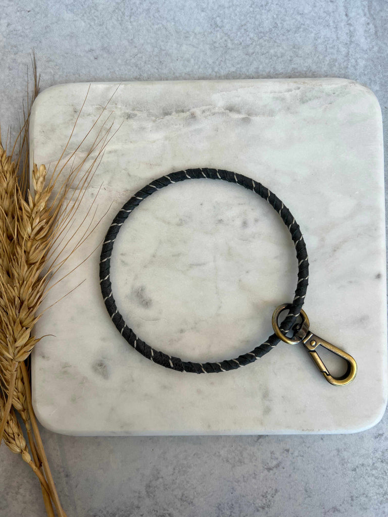 Hand-wrapped brass ring wristlet with remnant buffalo leather with Keychain