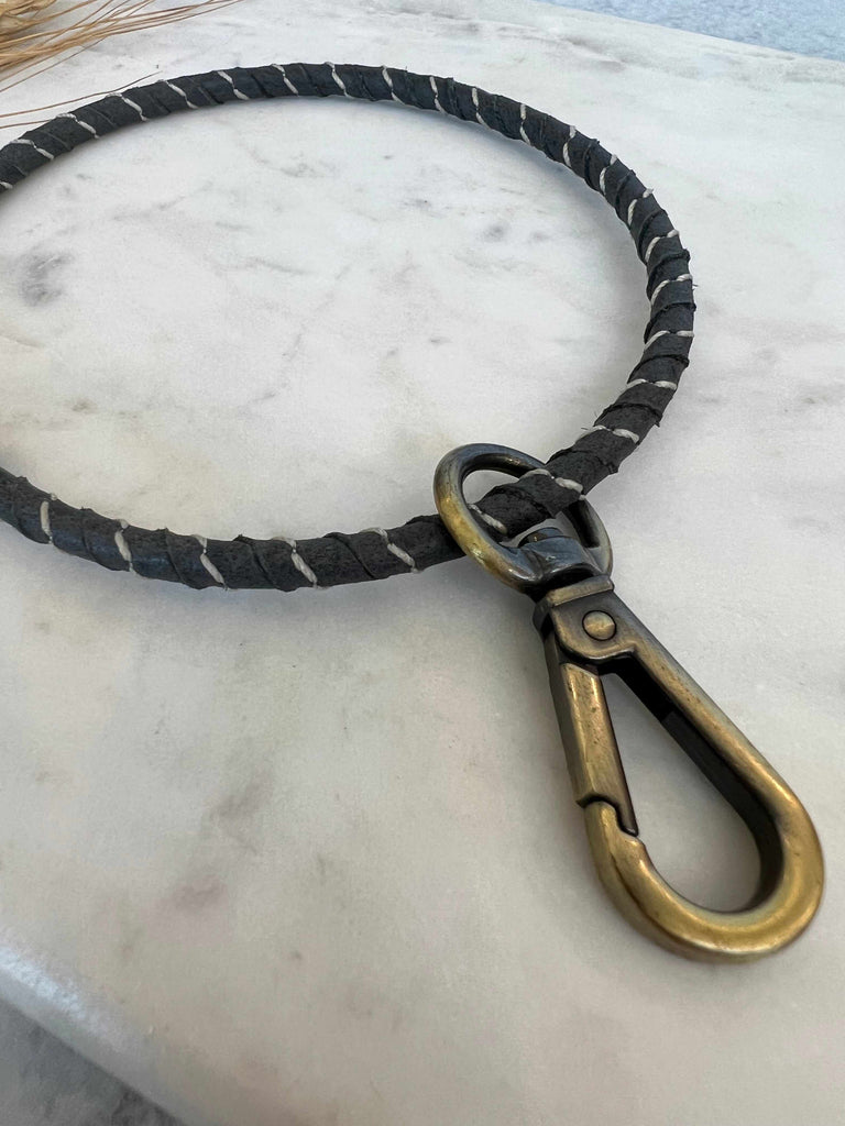 Keychain on Hand-wrapped brass ring wristlet with remnant buffalo leather