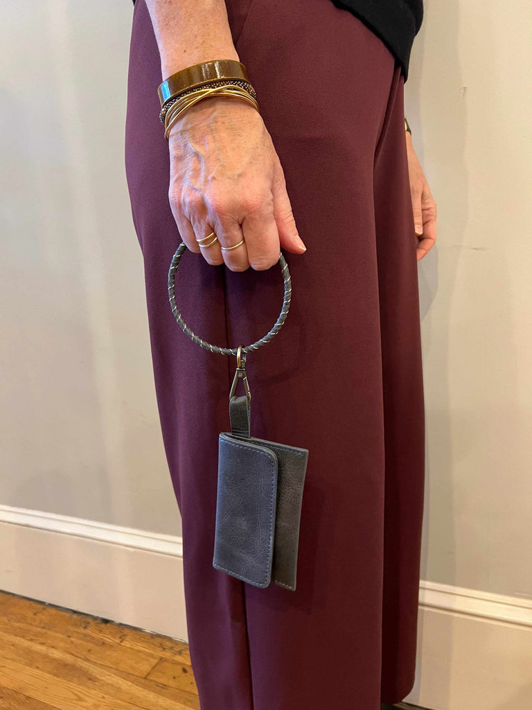 Woman Carrying Wristlet Keychain with Wallet Attached