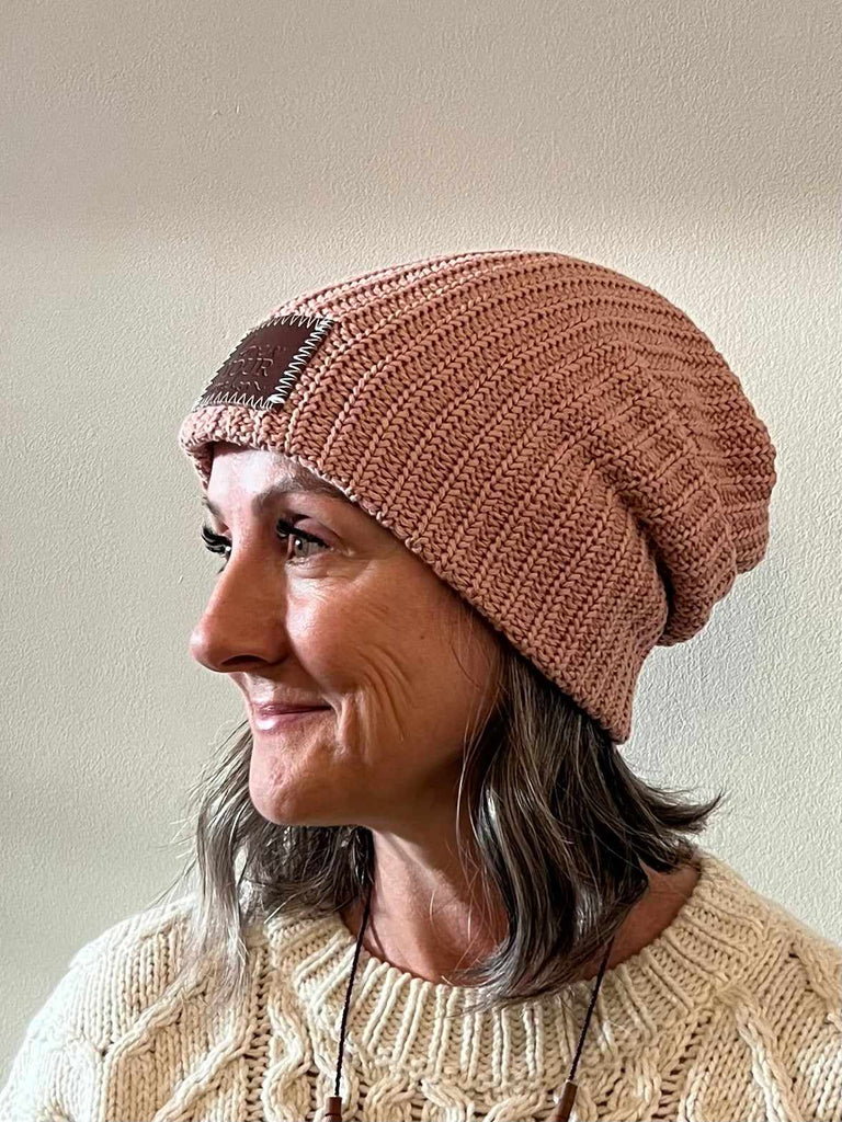 Woman wearing Love Your Melon Beanie in rose pink
