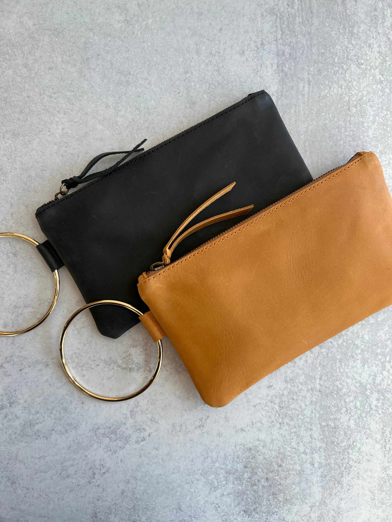 Handcrafted Able Fozi wristlets in black and cognac