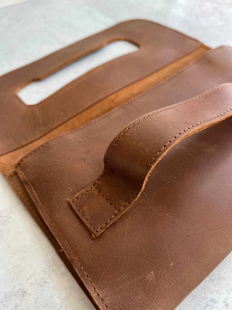 Open Mare leather handle clutch in whisky brown