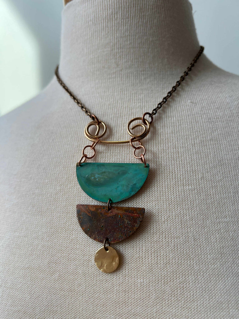 Little Elements copper and brass statement Necklace on mannequin