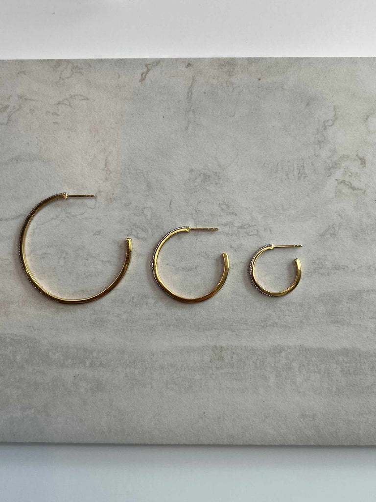 Three sizes of Ella Stein diamond hoops