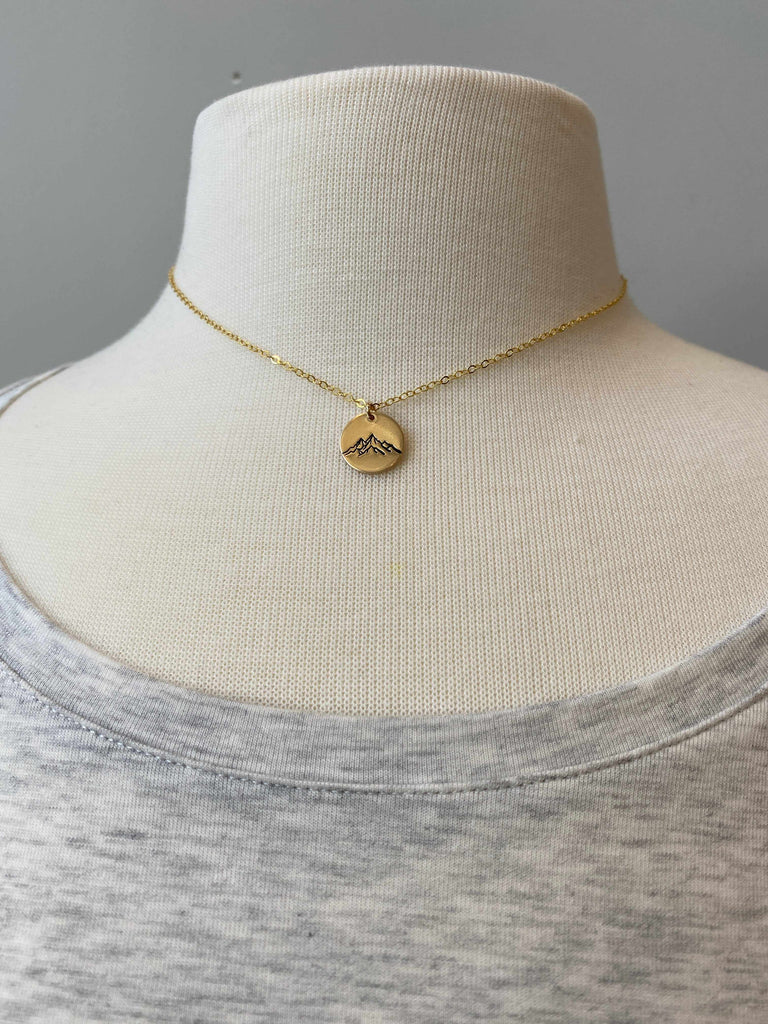 Mountain Range Disc Necklace in 14k gold fill on mannequin