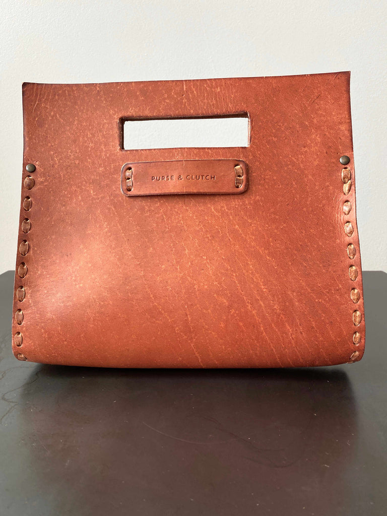 Everyday leather clutch in whisky brown
