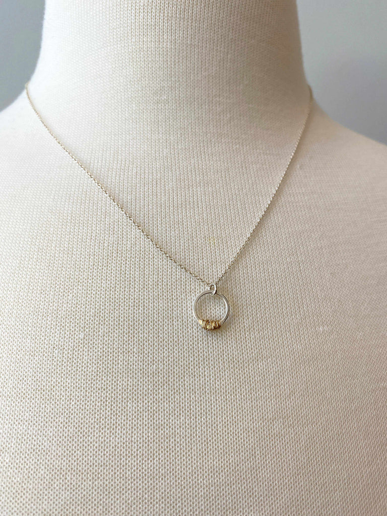 Mini sparky stitch necklace on mannequin