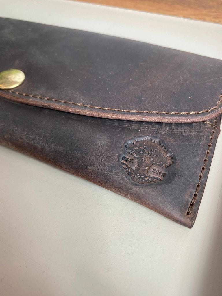 Logo detail on Leather Waylon Wallet in Chocolate