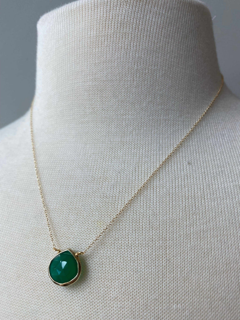 Green onyx gemstone necklace on mannequin