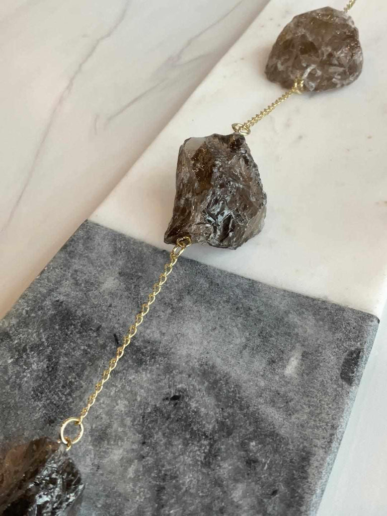 Close up of Ground + Purify smoky quartz and black tourmaline Wall Hanging