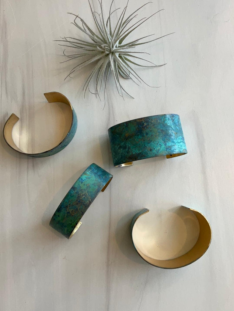 Different views of small and large Sea Foam Patina Cuffs