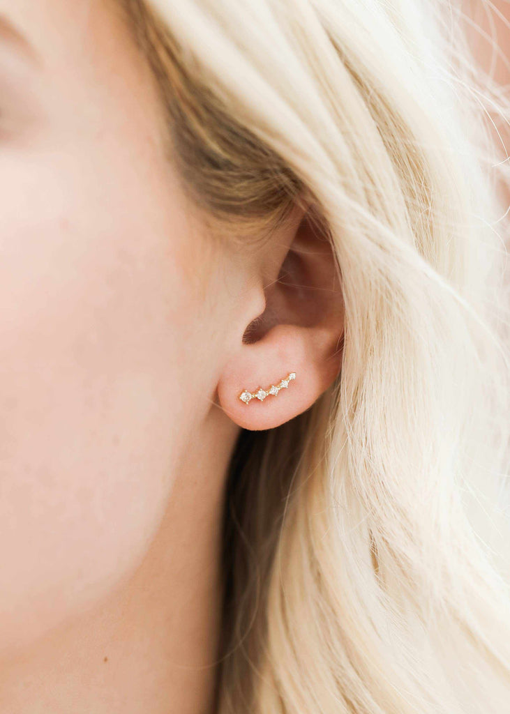 Woman wearing 18k gold plated sterling silver crawler earrings
