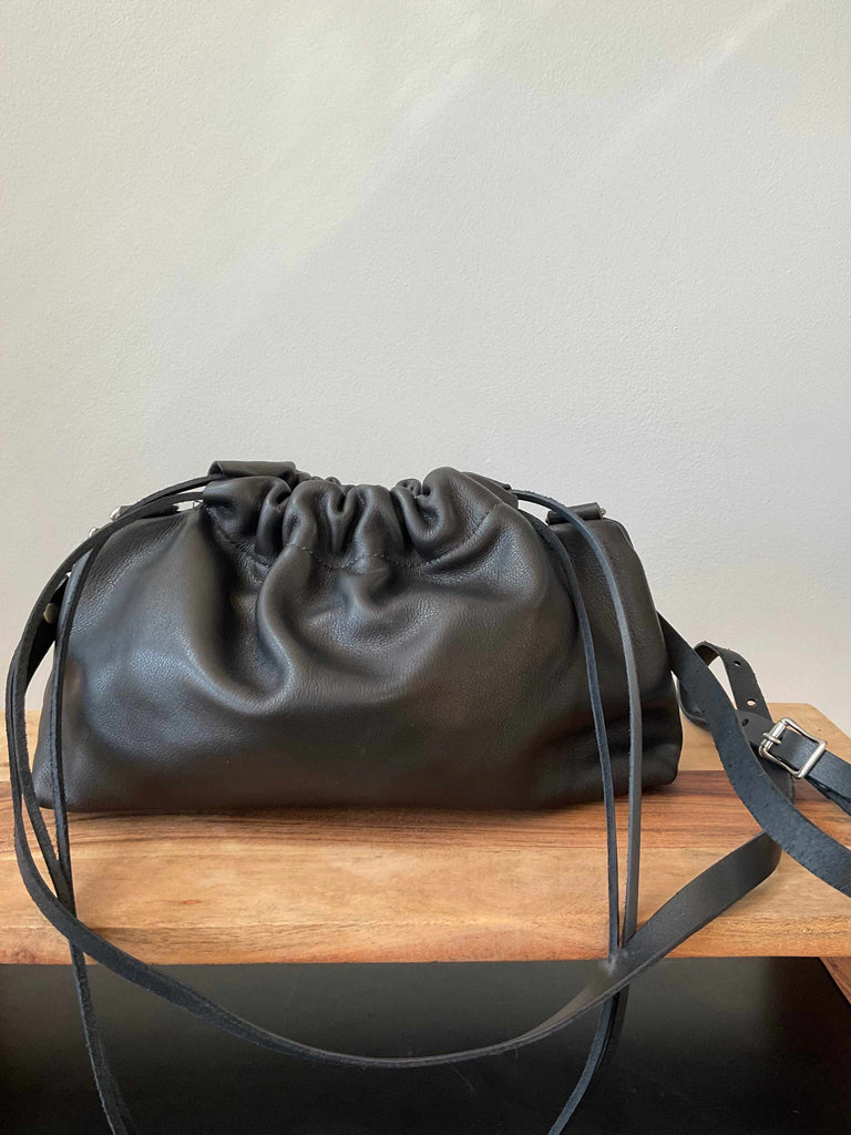 Black leather crossbody drawstring clutch