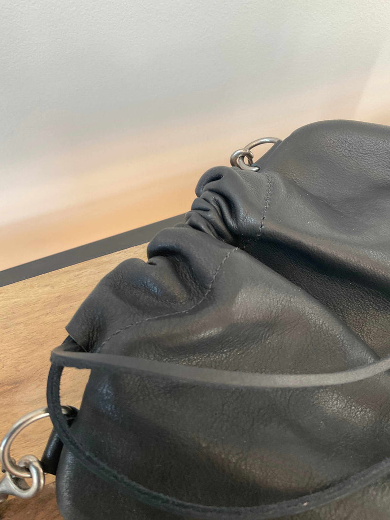 Black leather crossbody drawstring detail