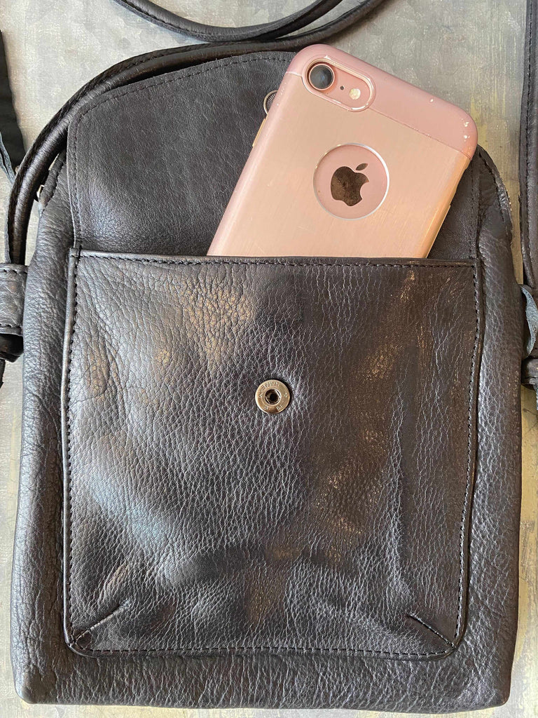 Front pocket on Latico Ezra leather crossbody bag in black