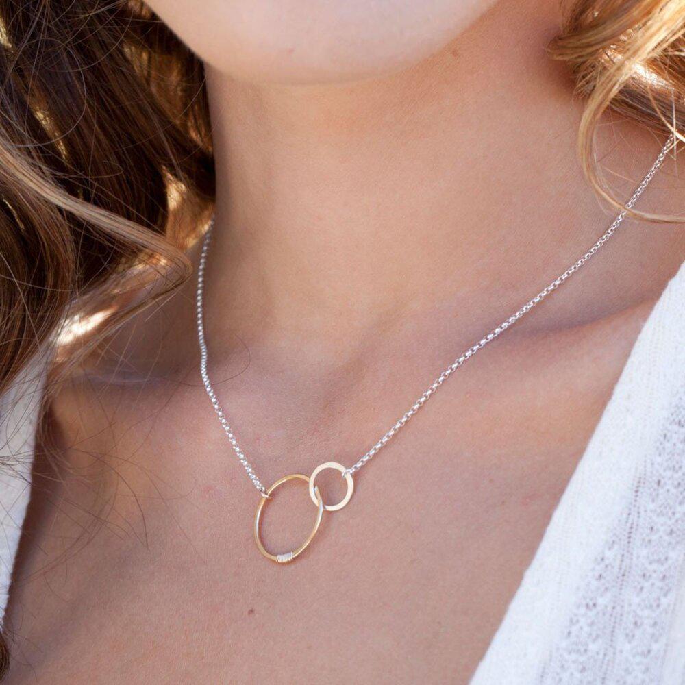 Woman wearing Love interlocking circles necklace